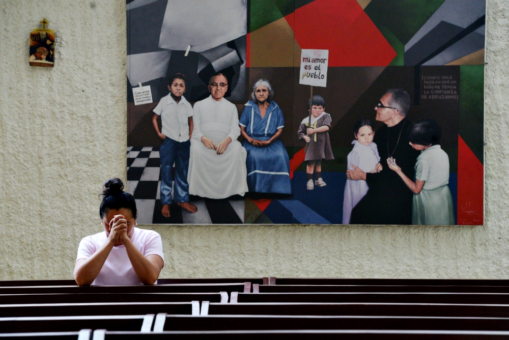 A woman prays in the chapel of Divine Providence Hospital in San Salvador May 21, 2015, two days before the beatification of Archbishop Óscar Romero, who was shot as he celebrated Mass in the hospital chapel March 24, 1980. (CNS/Lissette Lemus)