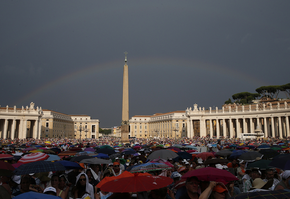 A rainbow is seen as Pope Francis attends a meeting with Catholic charismatics in St. Peter's Square July 3, 2015, at the Vatican. (CNS/Paul Haring) A rainbow is seen as Pope Francis attends a meeting with Catholic charismatics in St. Peter's Square July 3, 2015, at the Vatican. (CNS/Paul Haring)
