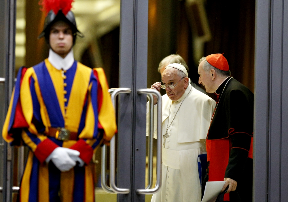 Pope Francis and Cardinal Pietro Parolin, Vatican secretary of state, talk as they leave the opening session of the Synod of Bishops on the family at the Vatican Oct. 5, 2015. (CNS/Paul Haring) Pope Francis and Cardinal Pietro Parolin, Vatican secretary of state, talk as they leave the opening session of the Synod of Bishops on the family at the Vatican Oct. 5, 2015. (CNS/Paul Haring)
