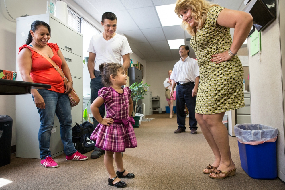 A family who immigrated from El Salvador meets with immigration caseworker Silvia Martinez, right, at the Catholic Charities office in St. Louis in 2015. (CNS/St. Louis Review/Lisa Johnston) A family who immigrated from El Salvador meets with immigration caseworker Silvia Martinez, right, at the Catholic Charities office in St. Louis in 2015. (CNS/St. Louis Review/Lisa Johnston)