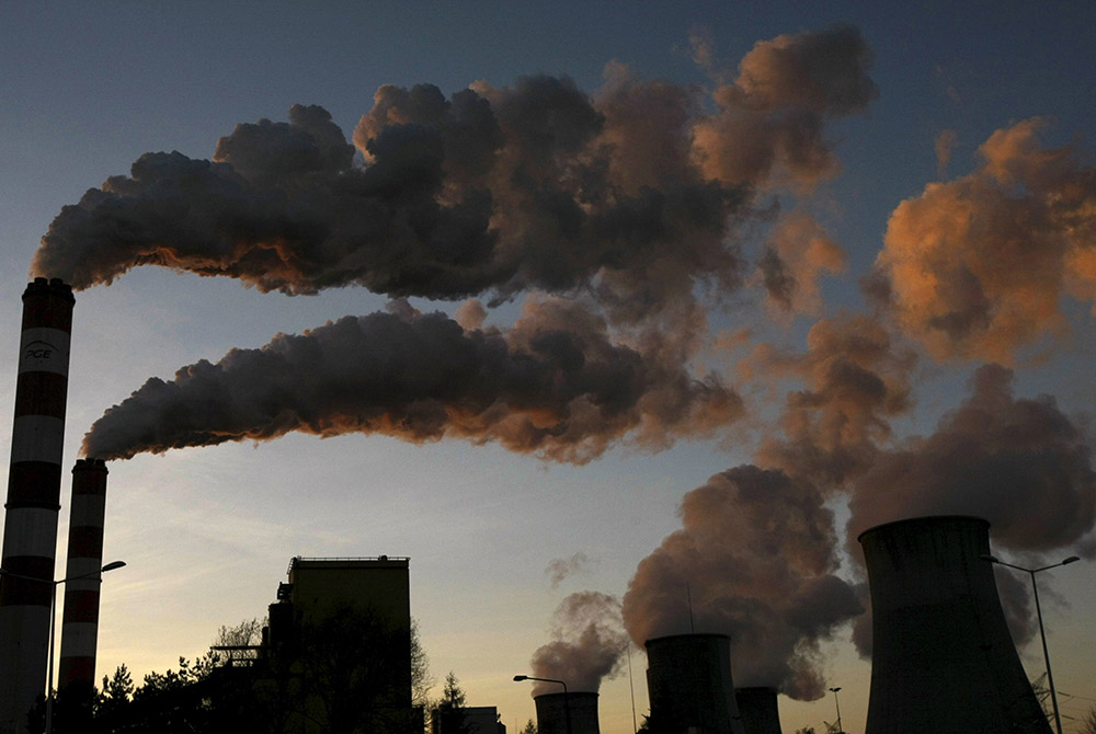 Smoke billows from the chimneys of power plant in 2014 in Belchatow, Poland. (CNS/Reuters/Kacper Pempel)