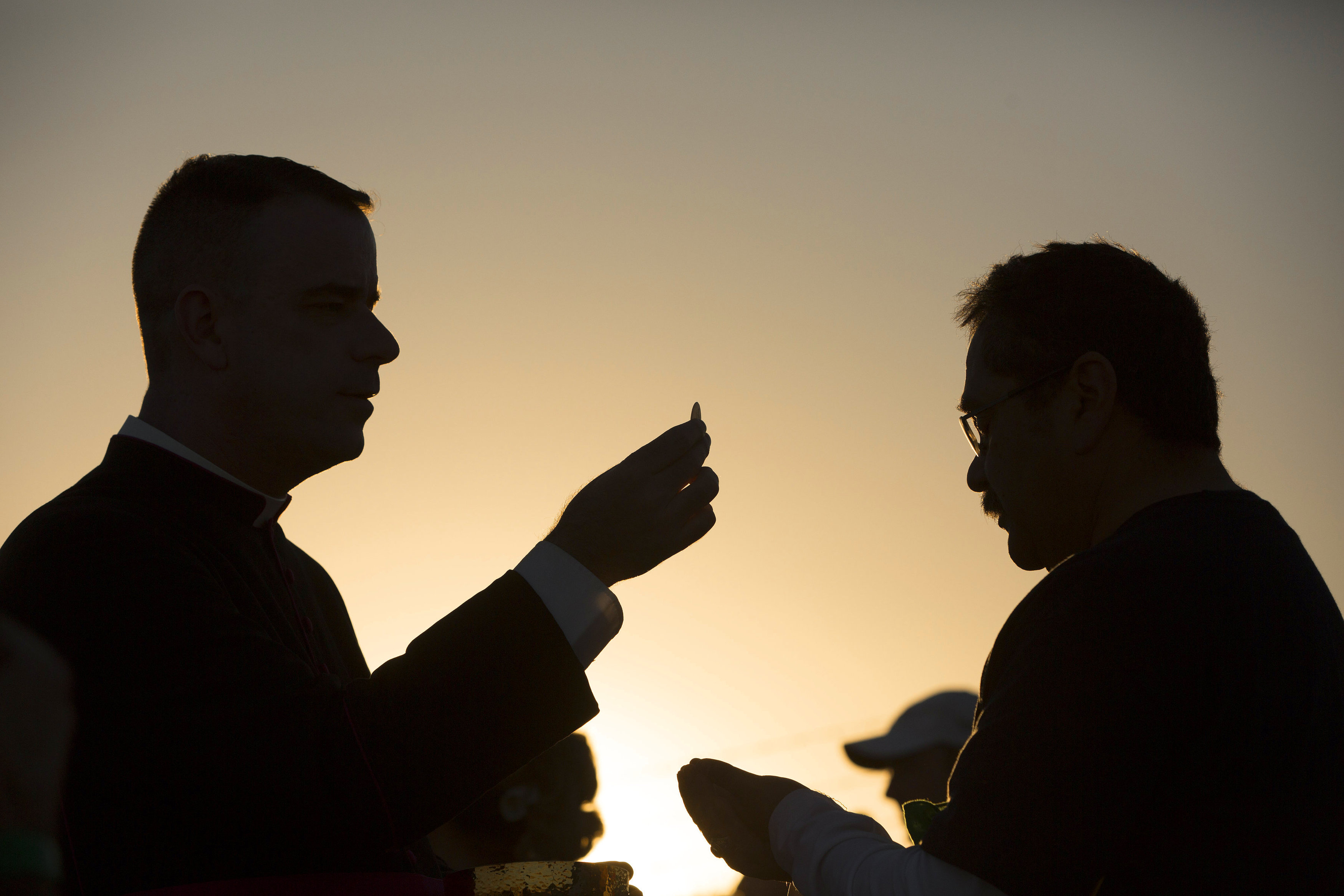 A man receives Communion on the U.S. side of the border in El Paso, Texas, Feb. 17, 2016, as Pope Francis celebrated Mass in Ciudad Juárez, Mexico. (CNS/Nancy Wiechec) A man receives Communion on the U.S. side of the border in El Paso, Texas, Feb. 17, 2016, as Pope Francis celebrated Mass in Ciudad Juárez, Mexico. (CNS/Nancy Wiechec)