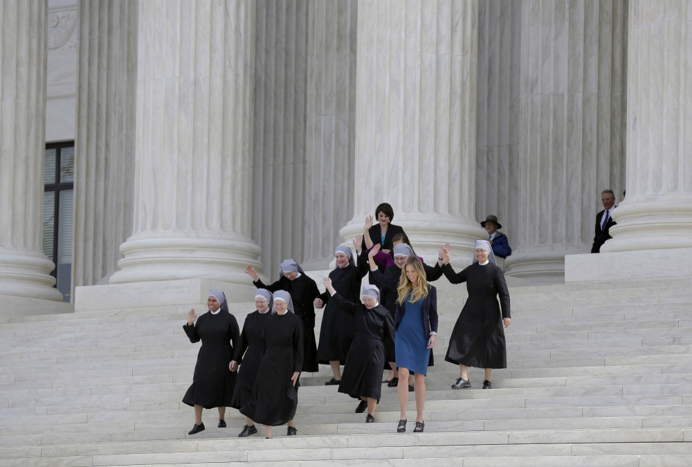 Members of the Little Sisters of the Poor and other women walk down the steps of the U.S. Supreme Court in Washington in March 2016 after attending oral arguments in the Zubik v. Burwell contraceptive mandate case. (CNS/Reuters/Joshua Roberts)