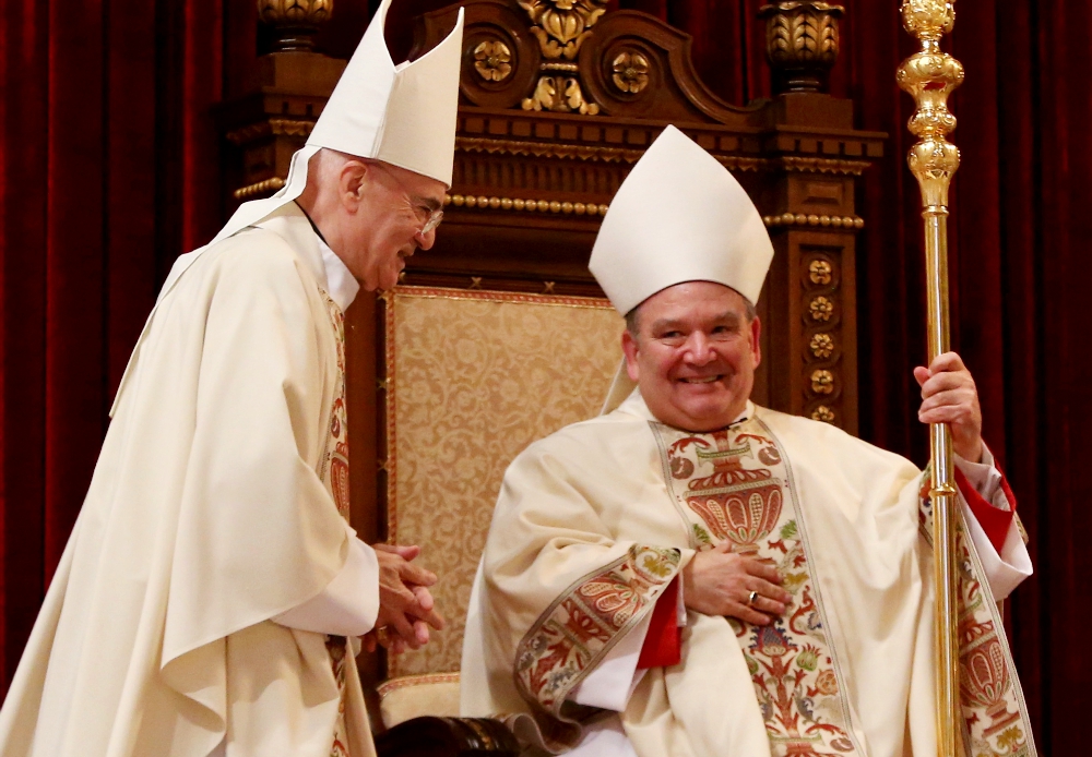 Archbishop Bernard Hebda takes the cathedra during his installation Mass May 13, 2016, at the Cathedral of St. Paul in St. Paul, Minnesota. Archbishop Carlo Maria Viganò, former nuncio to the U.S., is at left. (CNS/The Catholic Spirit/Dave Hrbacek) Archbishop Bernard Hebda takes the cathedra during his installation Mass May 13, 2016, at the Cathedral of St. Paul in St. Paul, Minnesota. Archbishop Carlo Maria Viganò, former nuncio to the U.S., is at left. (CNS/The Catholic Spirit/Dave Hrbacek)