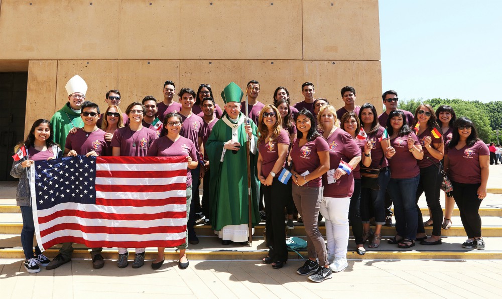 Los Angeles Archbishop José Gomez, center, and Auxiliary Bishop Robert Barron pose for a photo at the Cathedral of Our Lady of the Angels with a group of World Youth Day pilgrims who received a send-off blessing July 17, 2016. (CNS/Victor Aleman) Los Angeles Archbishop José Gomez, center, and Auxiliary Bishop Robert Barron pose for a photo at the Cathedral of Our Lady of the Angels with a group of World Youth Day pilgrims who received a send-off blessing July 17, 2016. (CNS/Victor Aleman)