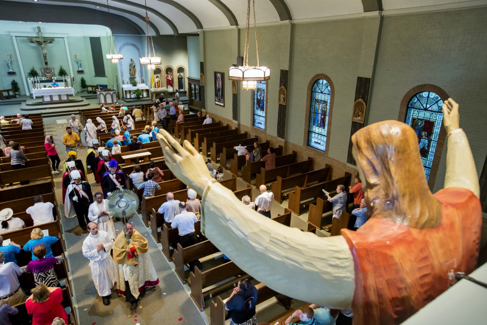 Fr. Michael Champagne carries the Blessed Sacrament at St. John Francis Regis in Arnauldville, Louisiana, Aug. 15, 2016, on the feast of the Assumption. (CNS photo/Tim Mueller) Fr. Michael Champagne carries the Blessed Sacrament at St. John Francis Regis in Arnauldville, Louisiana, Aug. 15, 2016, on the feast of the Assumption. (CNS photo/Tim Mueller)
