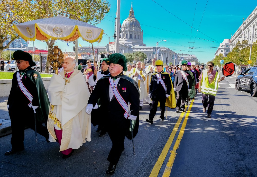Archbishop Salvatore Cordileone carries the monstrance as he leads hundreds of Catholics through San Francisco streets in a eucharistic procession Oct. 8, 2016. (CNS/Catholic San Francisco/Dennis Callahan)