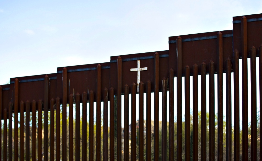 The bollard steel border fence splits the U.S. from Mexico in this view west of central Nogales, Arizona, Feb. 19. (CNS/Nancy Wiechec)