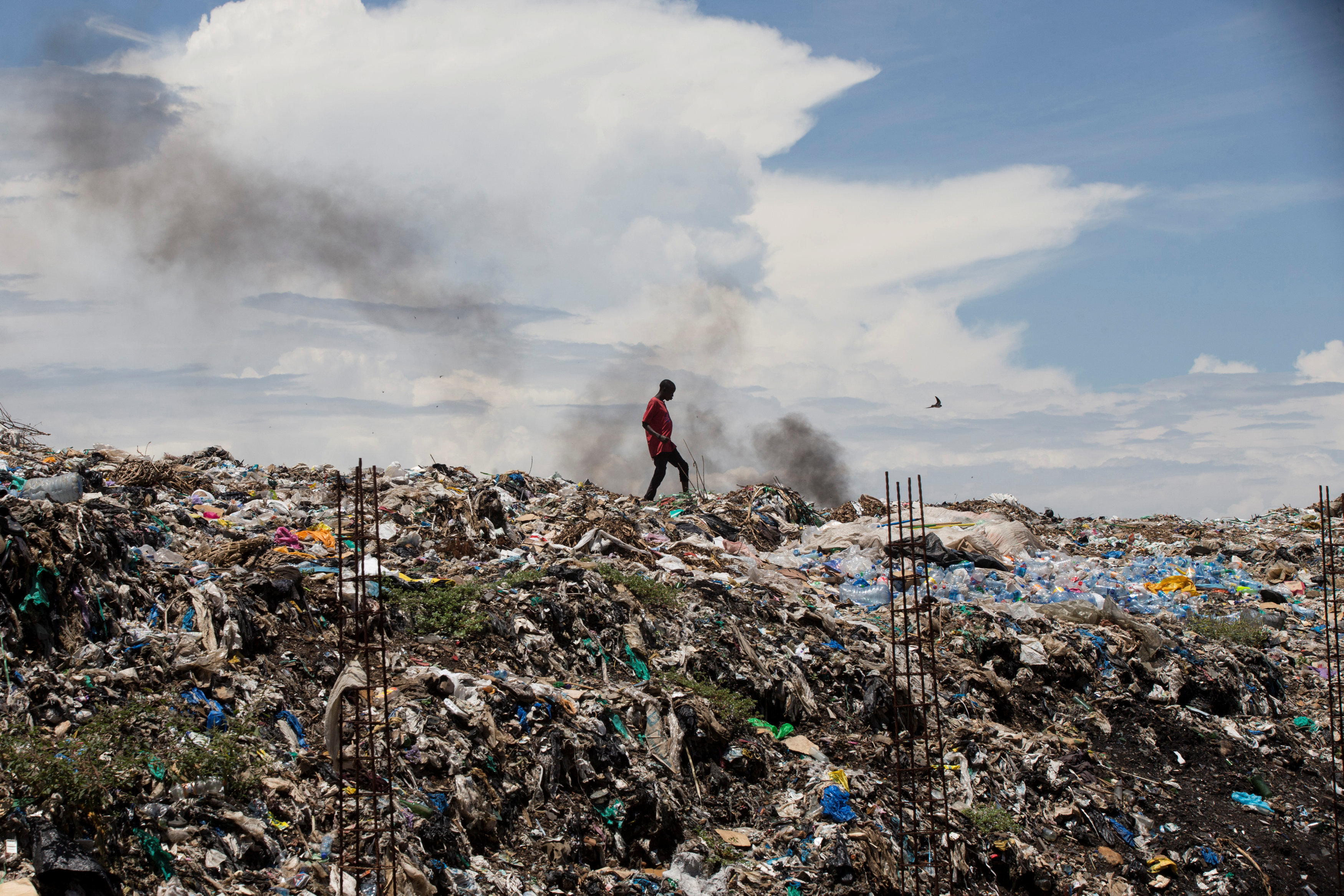 A man walks in a garbage dump in Kisumu, Kenya, April 18. (CNS/Baz Ratner, Reuters) A man walks in a garbage dump in Kisumu, Kenya, April 18. (CNS/Baz Ratner, Reuters)