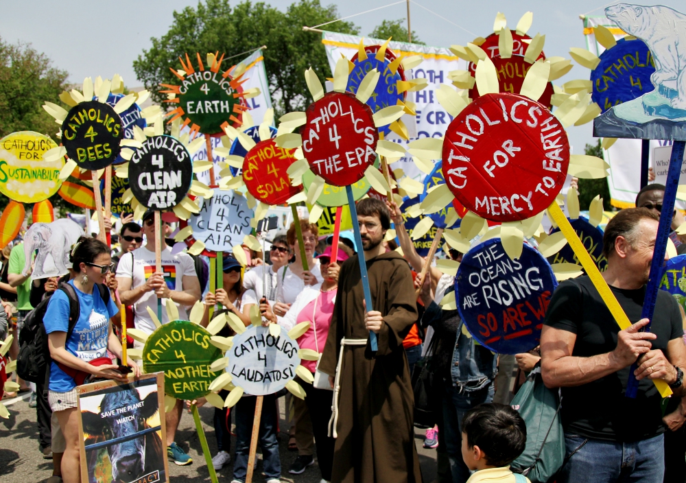 Parishioners from various parishes in New York City hold sunflower signs during the People's Climate March in Washington April 29, 2017. (CNS/Dennis Sadowski)