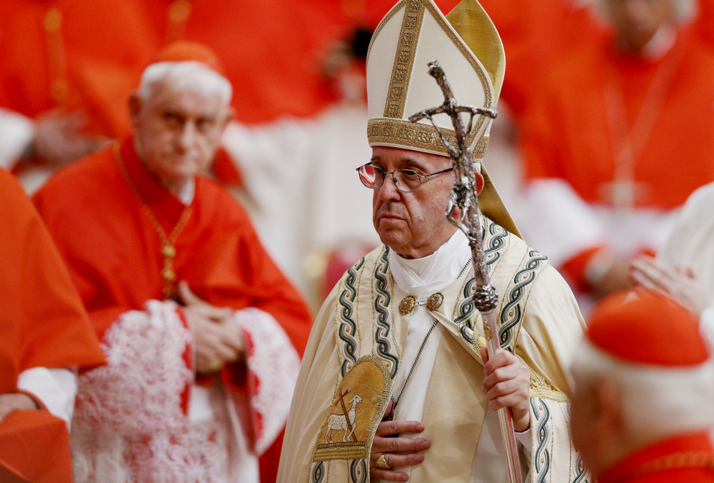 Pope Francis walks past cardinals as he leaves a consistory in St. Peter's Basilica at the Vatican June 28, 2017. (CNS/Paul Haring)