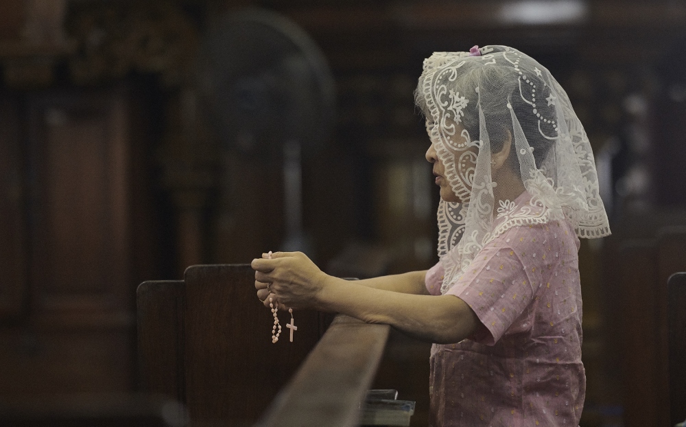 A woman prays at St. Mary's Cathedral in Yangon, Myanmar, Oct. 15. (CNS/Paul Jeffery) A woman prays at St. Mary's Cathedral in Yangon, Myanmar, Oct. 15. (CNS/Paul Jeffery)