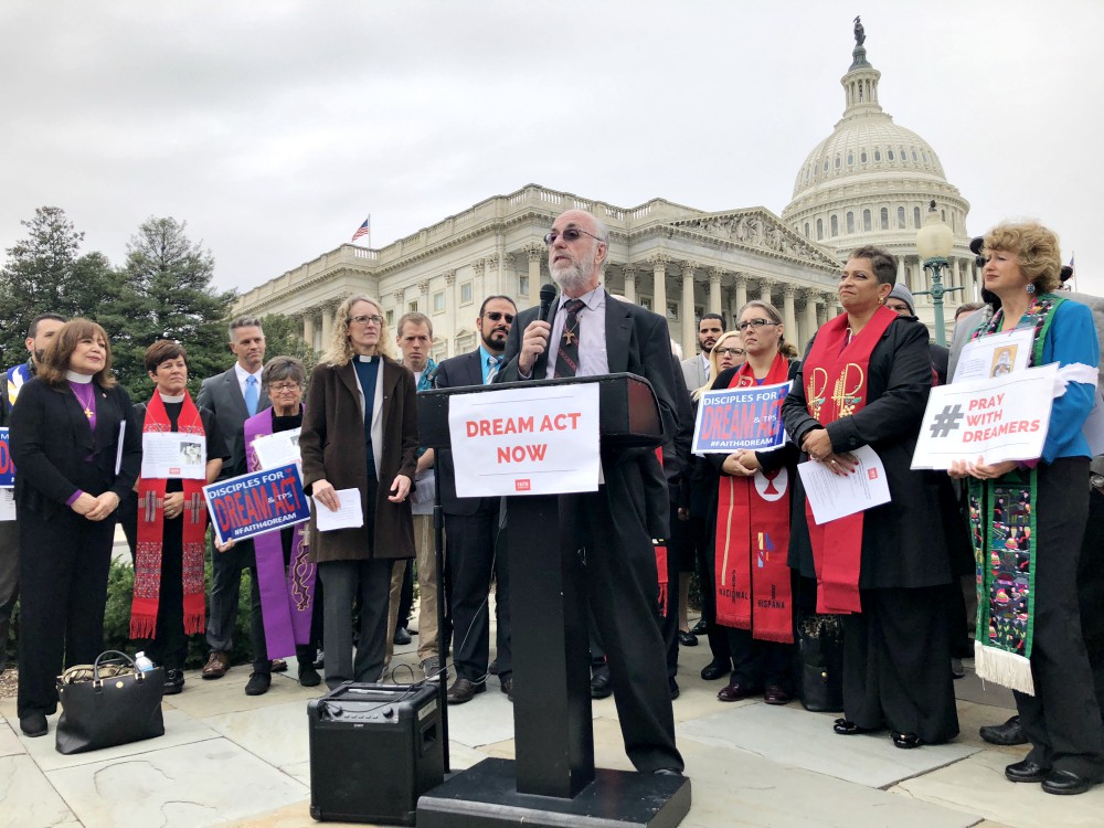 Patrick Carolan, who now is director of Catholic outreach for Vote Common Good, leads an immigrant rights protest in 2017 in Washington, D.C.  Carolan formerly served as executive director of Franciscan Action Network. (CNS/Rhina Guidos)