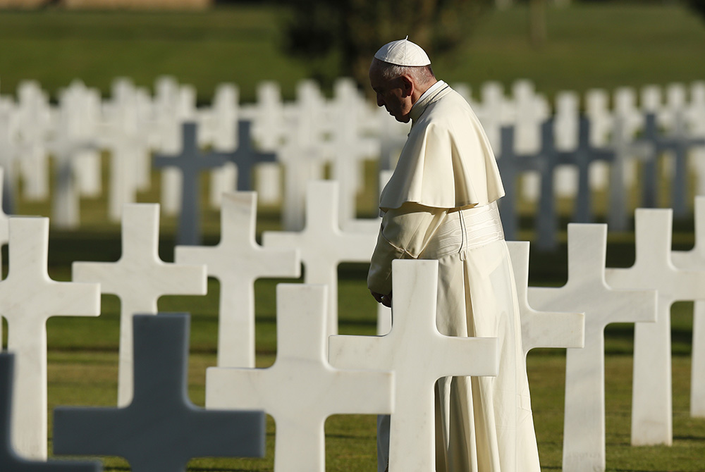 Pope Francis prays in the Sicily-Rome American Cemetery in Nettuno, Italy, Nov. 2, 2017, the feast of All Souls Pope Francis prays in the Sicily-Rome American Cemetery in Nettuno, Italy, Nov. 2, 2017, the feast of All Souls. The cemetery is the resting place of 7,860 American military members who died in World War II. (CNS/Paul Haring)