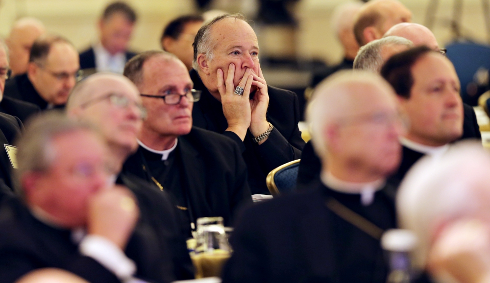 San Diego Bishop Robert McElroy, center, and other U.S. bishops listen to a speaker Nov. 13 during their fall general assembly in Baltimore. (CNS/Bob Roller) San Diego Bishop Robert McElroy, center, and other U.S. bishops listen to a speaker Nov. 13 during their fall general assembly in Baltimore. (CNS/Bob Roller)