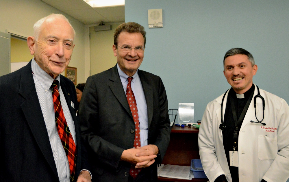 From left: Dr. Thomas Wallace; Albrecht von Boeselager, grand chancellor of the Order of Malta; and Jesuit Fr. Francisco Javier Diaz Diaz at the Order of Malta Clinic of Northern California in Oakland (CNS/Catholic Voice/Albert C. Pacciorni)
