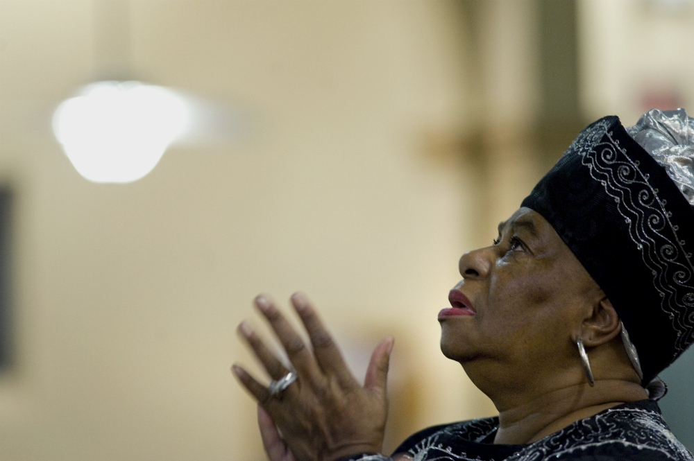 A woman prays on the second evening of an African American Catholic revival celebration Feb. 6, 2018, at St. Rita's Catholic Church in San Diego. (CNS/David Maung)