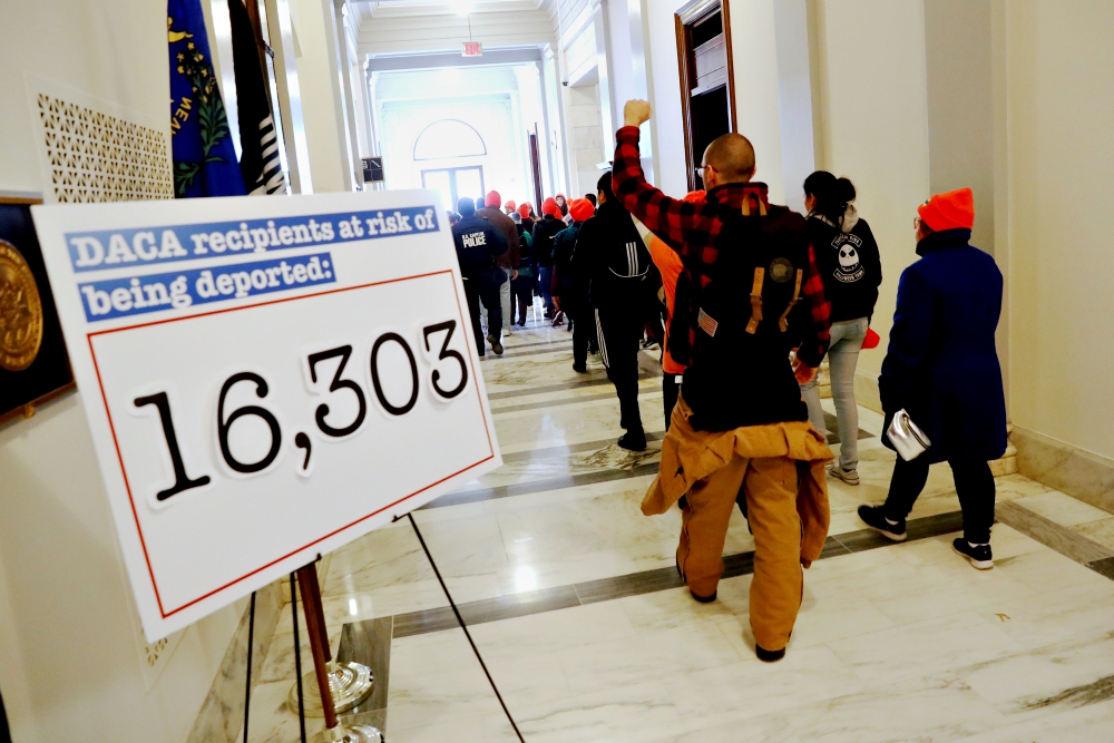 Demonstrators calling for new protections for recipients of the Deferred Action for Childhood Arrivals program walk through a Senate office building on Capitol Hill in late January in Washington. (CNS/Reuters/Jonathan Ernst)