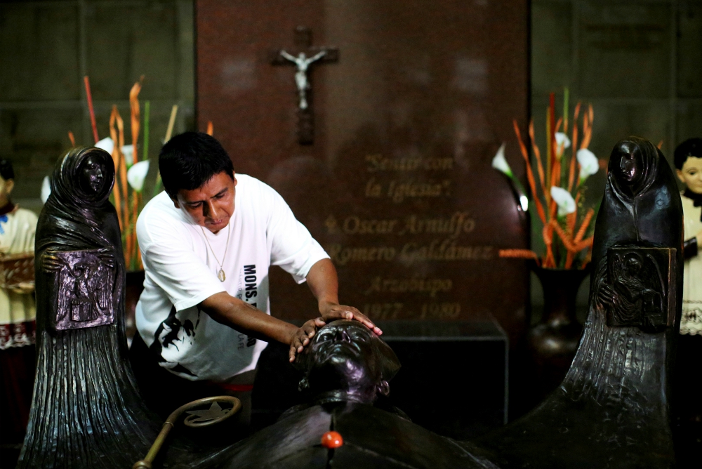 A man prays at the grave of Blessed Oscar Romero in 2017 at the Metropolitan Cathedral in San Salvador, El Salvador. (CNS/Reuters/Jose Cabezas) A man prays at the grave of Blessed Oscar Romero in 2017 at the Metropolitan Cathedral in San Salvador, El Salvador. (CNS/Reuters/Jose Cabezas)