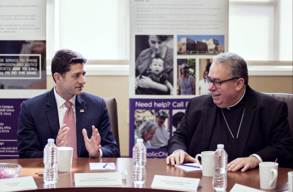 House Speaker Paul Ryan, R-Wisconsin, visits with Bishop Michael Olson of Fort Worth, Texas, during a private roundtable discussion on poverty-fighting efforts at Catholic Charities April 3. (CNS/North Texas Catholic Magazine/Juan Guajardo)