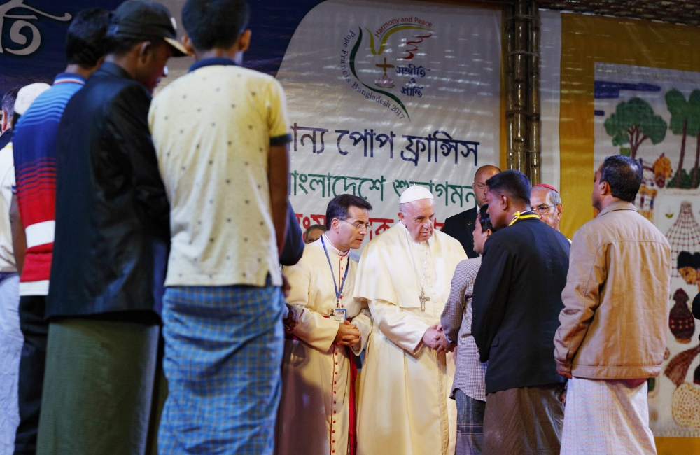 Pope Francis meets Rohingya refugees from Myanmar during an interreligious and ecumenical meeting for peace in the garden of the archbishop's residence in Dhaka, Bangladesh, Dec. 1, 2017. (CNS/Paul Haring)