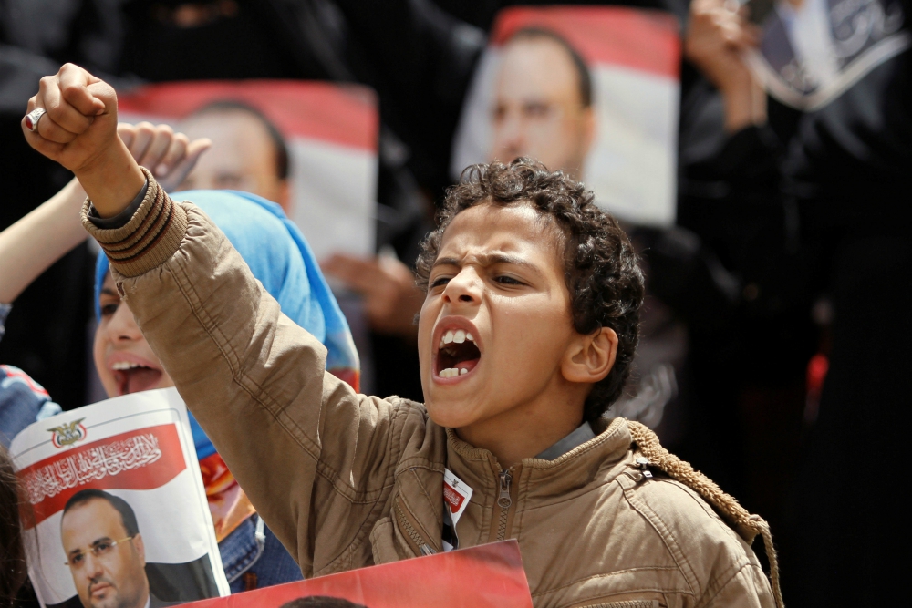 A boy shouts during a protest in Sanaa, Yemen, April 26. Catholic and other faith-based aid groups are urging an end to fighting in Yemen, where three years of war have created a humanitarian crisis. (CNS/Reuters/Mohamed al-Sayaghi) A boy shouts during a protest in Sanaa, Yemen, April 26. Catholic and other faith-based aid groups are urging an end to fighting in Yemen, where three years of war have created a humanitarian crisis. (CNS/Reuters/Mohamed al-Sayaghi)