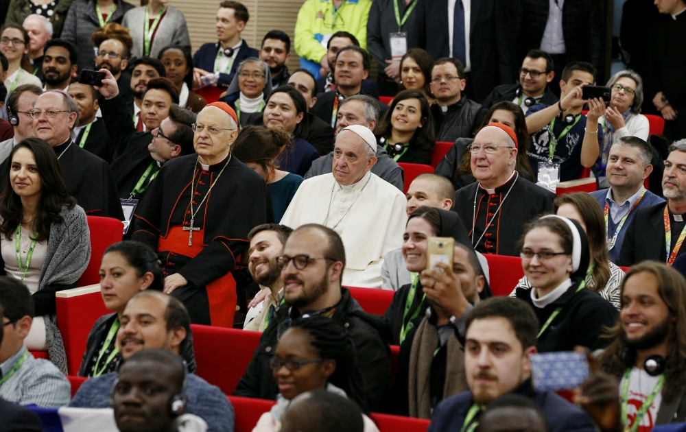 Cardinal Lorenzo Baldisseri, Pope Francis and Cardinal Kevin Farrell pose for a photo during a pre-synod gathering of youth delegates in Rome March 19. (CNS/Paul Haring)