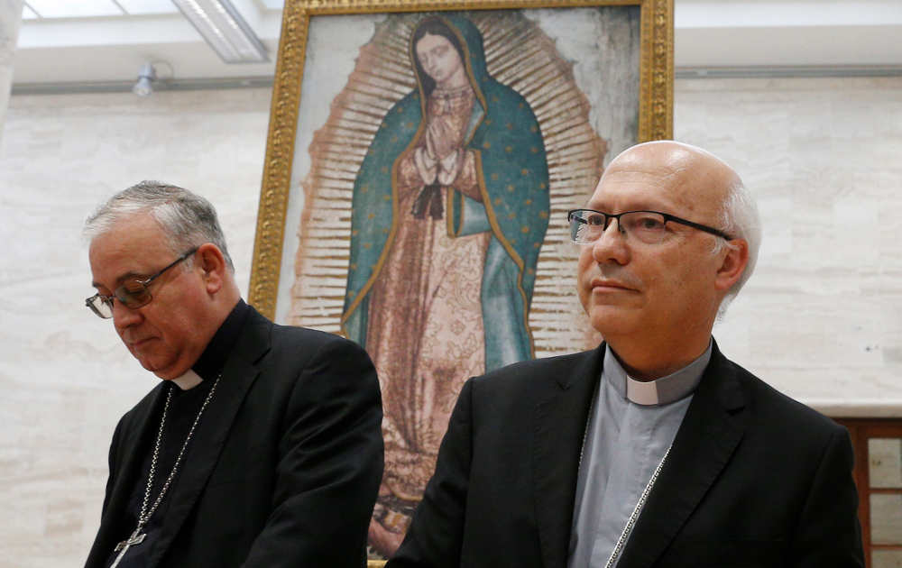 Bishop Juan Ignacio Gonzalez Errazuriz of San Bernardo, Chile, and Auxiliary Bishop Fernando Ramos Perez of Santiago, Chile, at a press conference in Rome May 18 announcing that every bishop in Chile offered his resignation to Pope Francis after a three-d