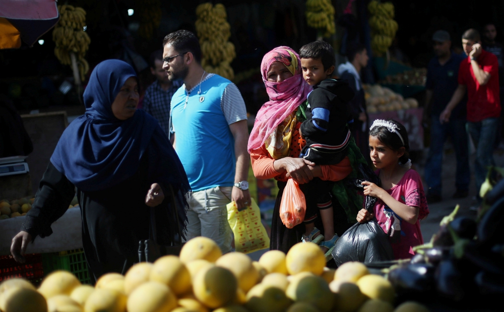 Palestinians shop at a market in the central Gaza Strip May 17. (CNS/Reuters/Ibraheem Abu Mustafa)