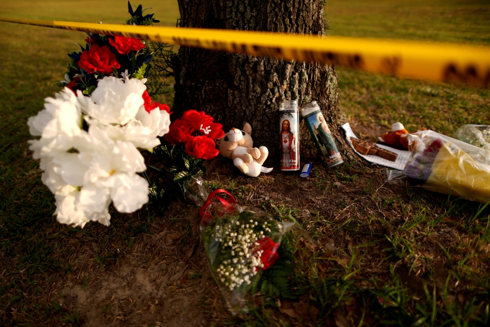 Candles with images of Christ and other items are seen May 20 at a makeshift memorial in memory of the victims killed in a shooting at the Santa Fe High School in Texas. (CNS/Reuters/Jonathan Bachman) Candles with images of Christ and other items are seen May 20 at a makeshift memorial in memory of the victims killed in a shooting at the Santa Fe High School in Texas. (CNS/Reuters/Jonathan Bachman)