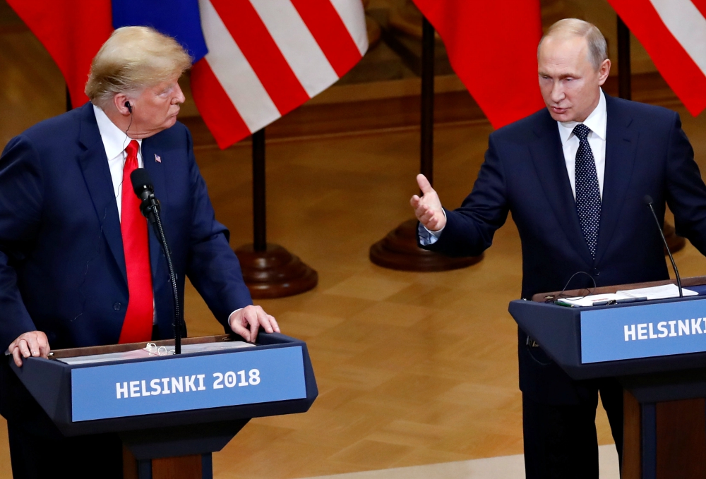 U.S. President Donald Trump and Russian President Vladimir Putin hold a joint news conference after their July 16 meeting in Helsinki, Finland. (CNS/Reuters/Leonhard Foeger)