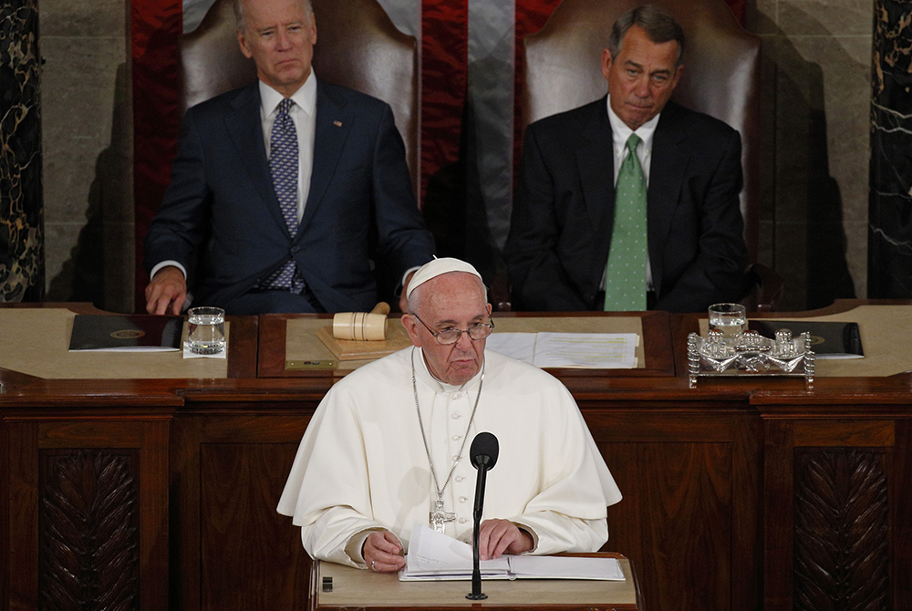 Pope Francis addresses a joint meeting of Congress in Washington Sept. 24, 2015. Also pictured are then-Vice President Joe Biden and then-House Speaker John Boehner, both of whom are Catholic. (CNS/Paul Haring)