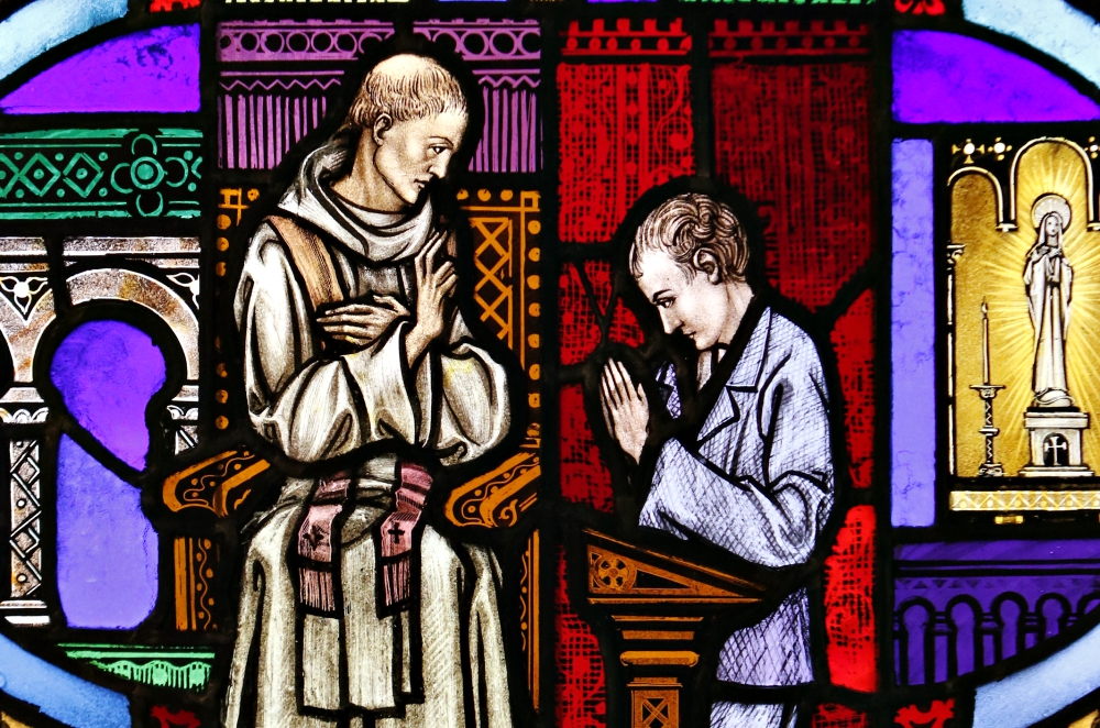 The sacrament of reconciliation is depicted in a stained-glass window at St. Aloysius Church in Great Neck, New York. (CNS/Gregory A. Shemitz)