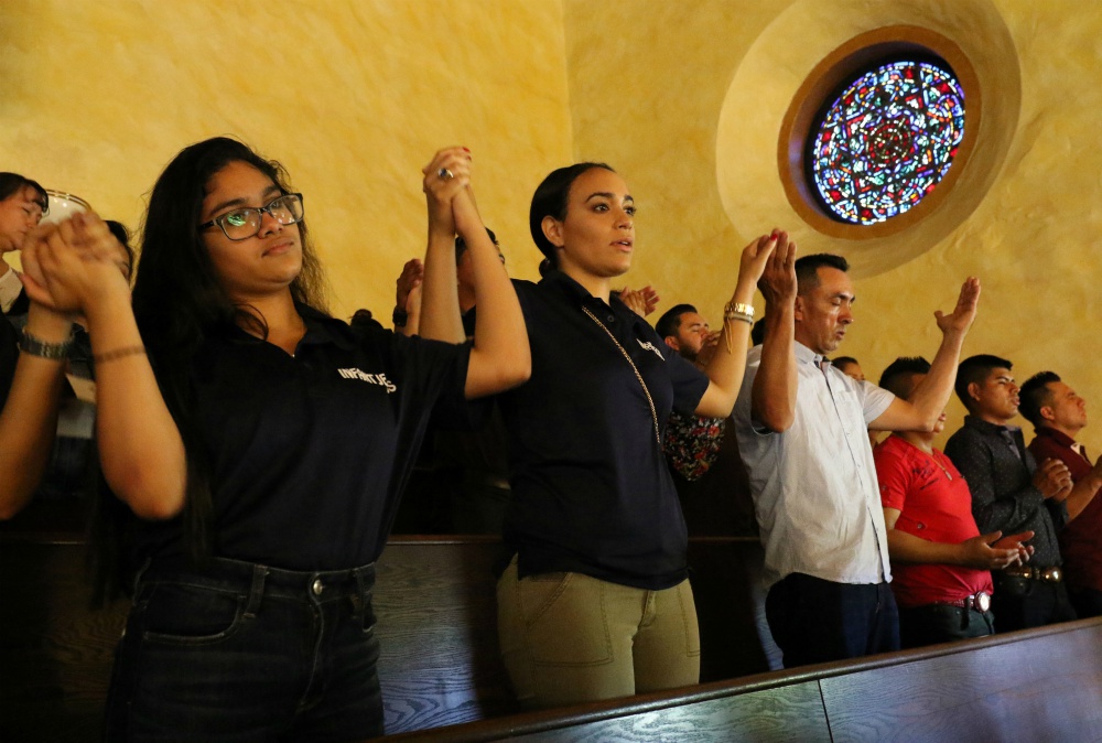 Participants recite the Lord's Prayer during Mass at the Labor Day Encuentro gathering at Immaculate Conception Seminary in Huntington, New York, Sept. 3, 2018. (CNS/Long Island Catholic/Gregory A. Shemitz)