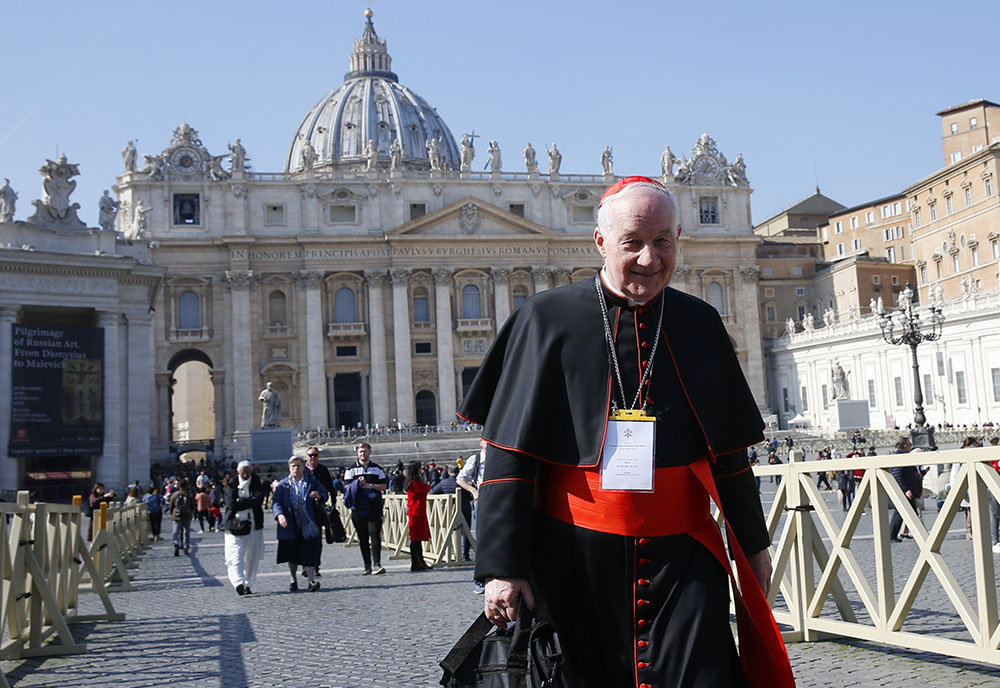 Cardinal Marc Ouellet, prefect of the Congregation for Bishops, walks through St. Peter's Square after attending the opening session of the meeting on the protection of minors in the church at the Vatican Feb. 21, 2019. (CNS/Paul Haring)