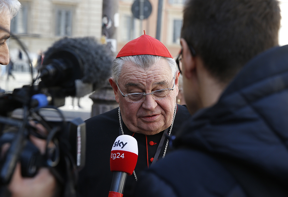 Cardinal Dominik Duka of Prague, Czech Republic, talks with journalists as he leaves the opening session of the meeting on the protection of minors in the church Feb. 21, 2019, at the Vatican. (CNS/Paul Haring) Cardinal Dominik Duka of Prague, Czech Republic, talks with journalists as he leaves the opening session of the meeting on the protection of minors in the church Feb. 21, 2019, at the Vatican. (CNS/Paul Haring)