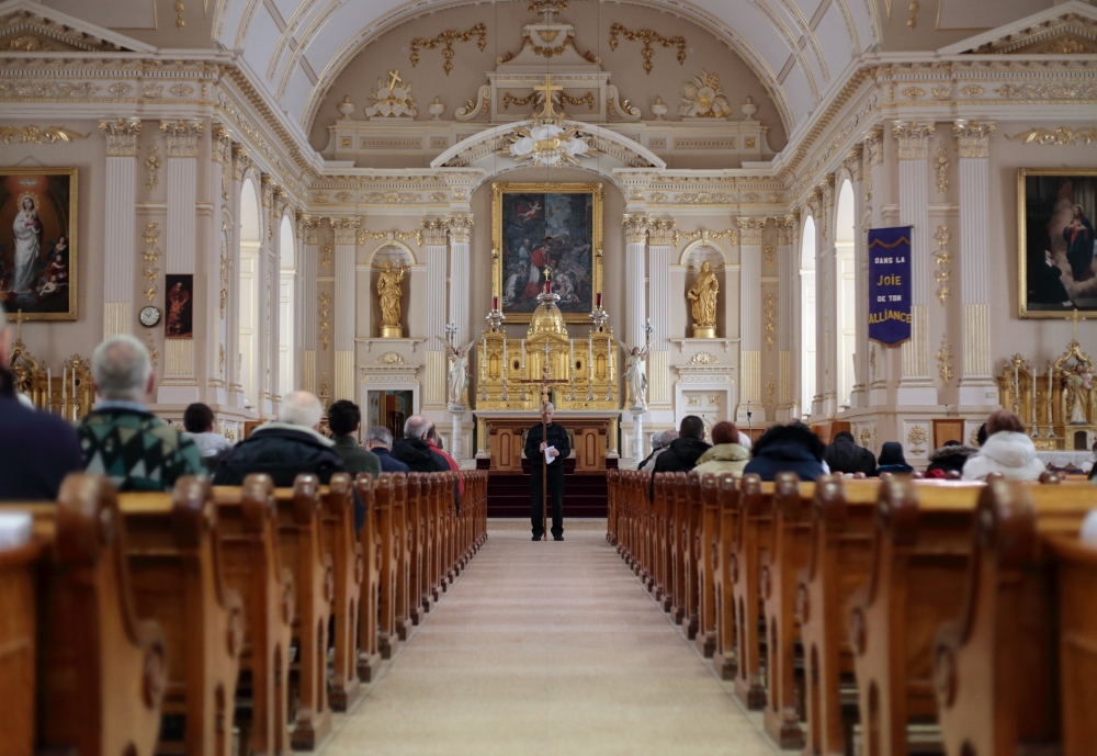 Parishioners from Saint-Charles-Borromée gather inside their 19th-century church in Quebec in 2016. A third of Canada's Christian architecture, some 9,000 churches, will close in the next 10 years, according to the National Trust for Canada. (CNS/Reuters)