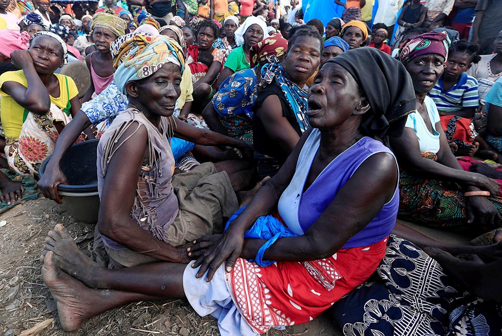 Women rest at a camp for displaced people in the aftermath of Cyclone Idai March 30, 2019, in Beira, Mozambique. (CNS/Zohra Bensemra, Reuters)