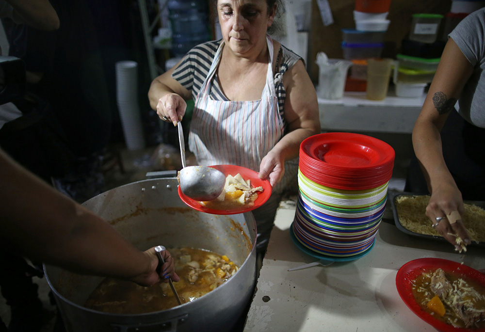 Women prepare food at a soup kitchen April 3, 2019, in Buenos Aires, Argentina. (CNS/Reuters/Agustin Marcarian)