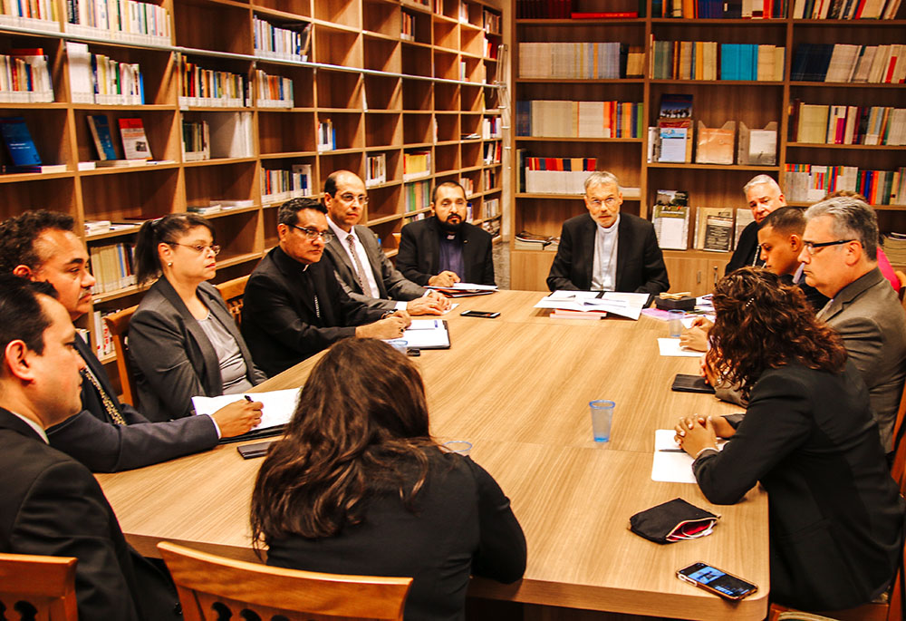 Encuentro representatives from the United States meet with German Bishop Franz-Peter Tebartz-van-Elst, delegate for catechesis at the Pontifical Council for the New Evangelization, at the Vatican Sept. 16, 2019. (CNS)