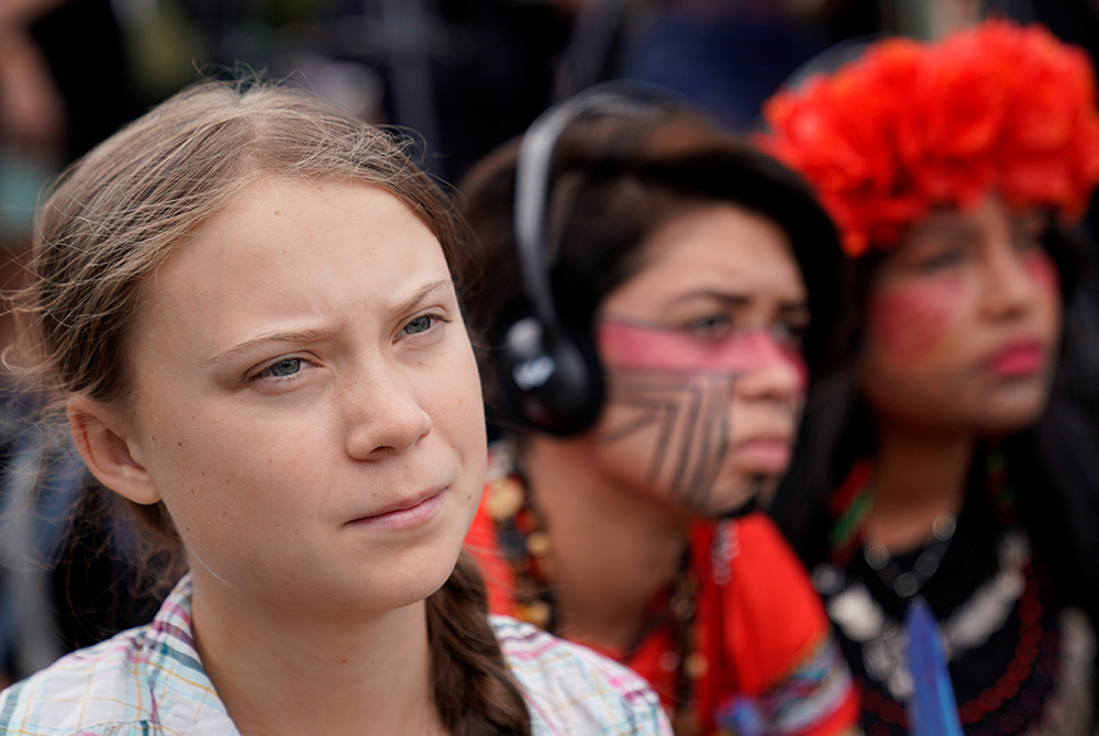 Swedish climate activist Greta Thunberg, then 16, listens to speakers during a climate change demonstration outside the U.S. Supreme Court Sept. 18, 2019, in Washington. (CNS/Kevin Lamarque, Reuters) Swedish climate activist Greta Thunberg, then 16, listens to speakers during a climate change demonstration outside the U.S. Supreme Court Sept. 18, 2019, in Washington. (CNS/Kevin Lamarque, Reuters)