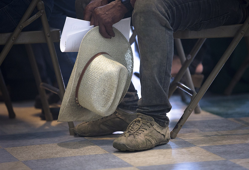 A farmworker attends Mass at the Centro Sin Fronteras in El Paso, Texas, Sept. 25, 2019, during a pastoral encounter by U.S. bishops with migrants at the border. (CNS/Tyler Orsburn)