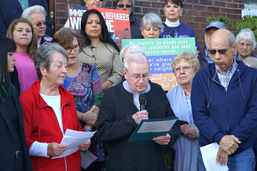 Fr. Jim Flynn, a retired priest of the Archdiocese of Louisville, Kentucky, reads a portion of a statement Oct. 8, 2019, at St. William Church that reaffirmed the parish’s commitment as a sanctuary church. (CNS/The Record/Jessica Able) Fr. Jim Flynn, a retired priest of the Archdiocese of Louisville, Kentucky, reads a portion of a statement Oct. 8, 2019, at St. William Church that reaffirmed the parish’s commitment as a sanctuary church. (CNS/The Record/Jessica Able)