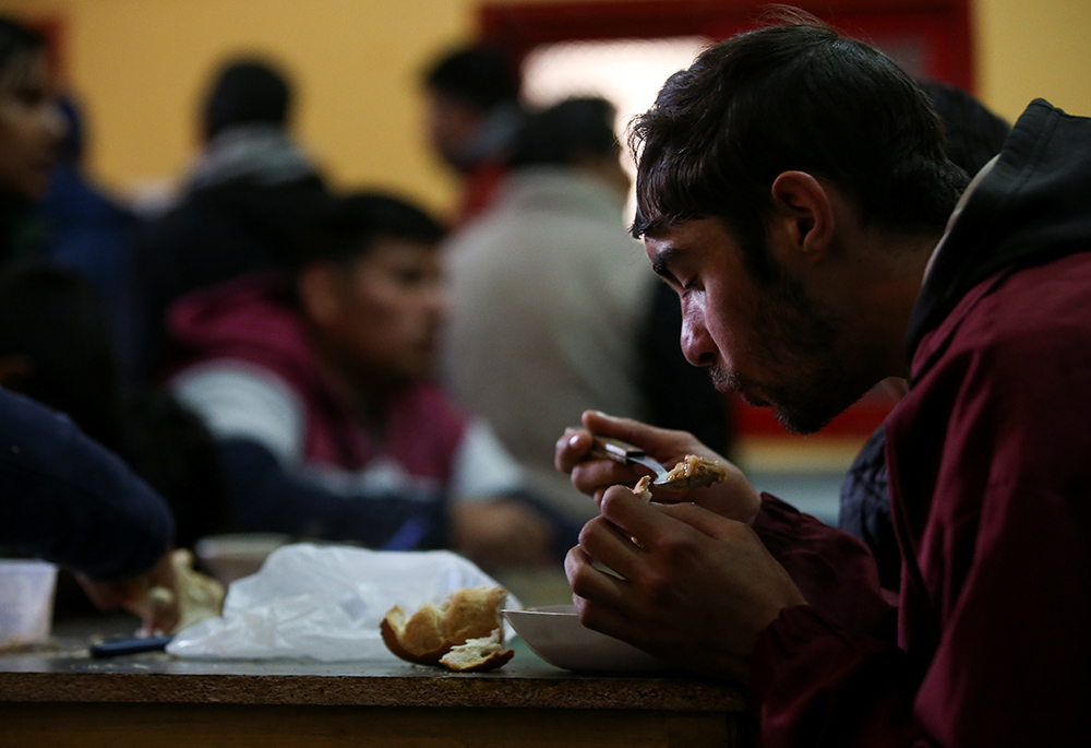 A man eats his lunch at a soup kitchen in the basement of St. Leo Catholic Church in Detroit. (CNS/Reuters/Mark Blinch)