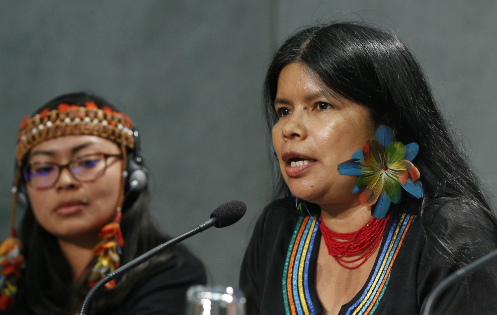 Patricia Gualinga, an indigenous rights defender from Ecuador, speaks at a news conference to discuss the Synod of Bishops for the Amazon at the Vatican Oct. 17, 2019. Also pictured is Leah Rose Casimero, an indigenous representative from Guyana. (CNS) Patricia Gualinga, an indigenous rights defender from Ecuador, speaks at a news conference to discuss the Synod of Bishops for the Amazon at the Vatican Oct. 17, 2019. Also pictured is Leah Rose Casimero, an indigenous representative from Guyana. (CNS)