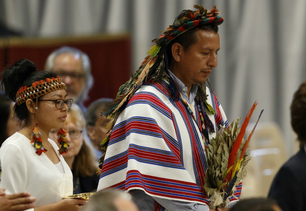 Indigenous people carry offertory gifts as Pope Francis celebrates the concluding Mass of the Synod of Bishops for the Amazon at the Vatican Oct. 27, 2019. (CNS/Paul Haring)