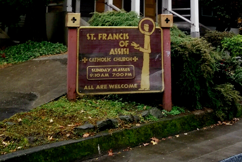 A sign welcomes all to St. Francis of Assisi Church in Portland, Oregon. (Peter Feuerherd)