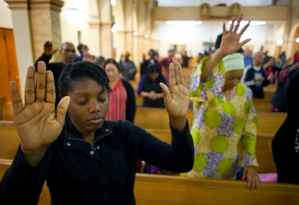 A young woman prays on the second evening of an African American Catholic revival celebration Feb. 6, 2018, at St. Rita's Catholic Church in San Diego. (CNS/David Maung) A young woman prays on the second evening of an African American Catholic revival celebration Feb. 6, 2018, at St. Rita's Catholic Church in San Diego. (CNS/David Maung)