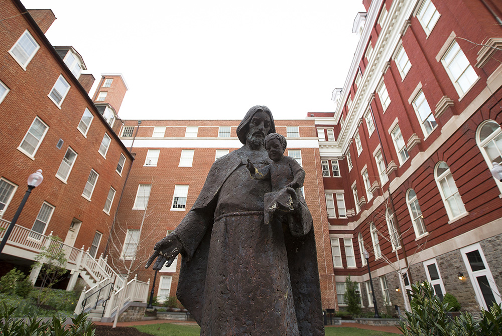 Mulledy Hall, also known as Freedom Hall, center, is seen April 4, 2017, on the campus of Georgetown University. The building has been renamed after Isaac Hawkins, the first enslaved person listed in the Jesuit university's documents on its selling of sla