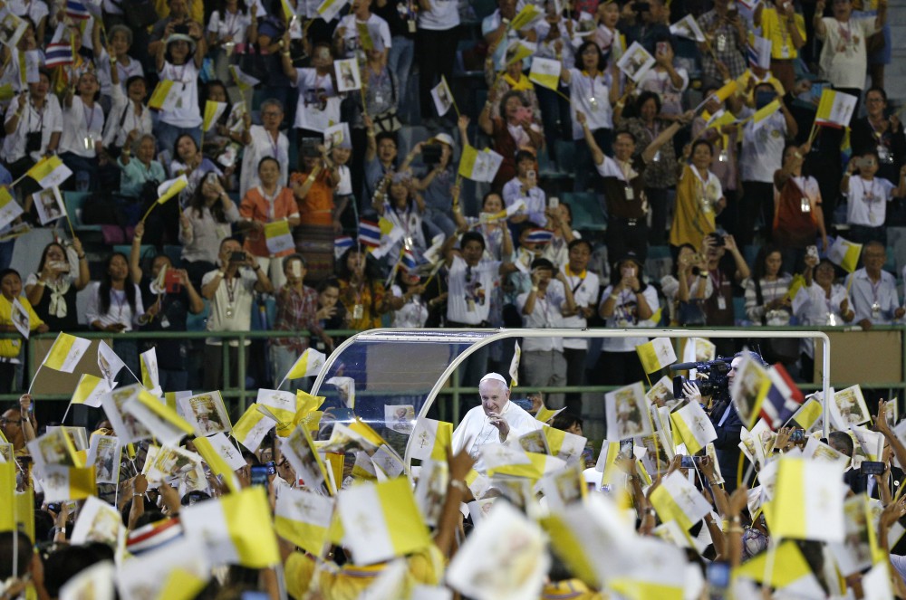 Pope Francis greets the crowd as he arrives to celebrate Mass in National Stadium in Bangkok Nov. 21, 2019. (CNS photo/Paul Haring)